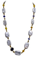 Hand-inserted necklace with lapis and amber balls