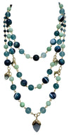 Hand-inserted necklace with lapis and amber balls